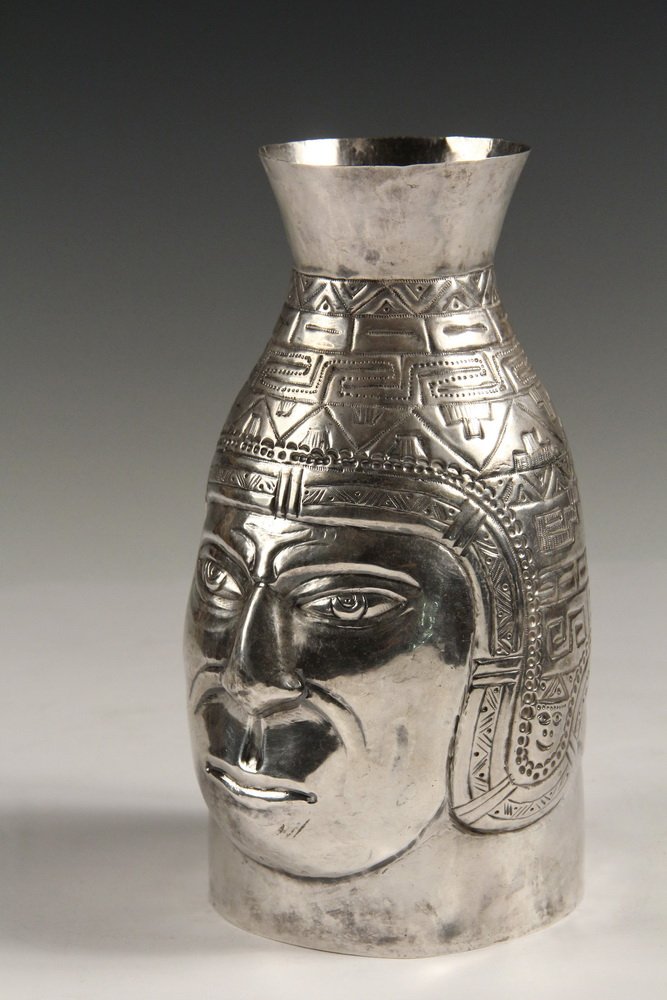 CARAFE - South American Sterling Silver Handleless: CARAFE - South American Sterling Silver Handleless Vessel with repousse decoration depicting the head of an Incan man, probably Peruvian; marked on base with "IJC" in hexagonal cartouche, "mano", and 
