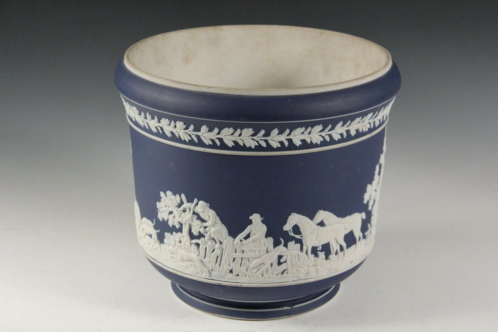 ADAMS JARDINIERE - Fox Hunting Themed Jasperware Cache: ADAMS JARDINIERE - Fox Hunting Themed Jasperware Cache Pot in white over cobalt blue, circa 1890, marked on underside 'Adams, Tunstall, England', 7 3/4" x 8 3/4" diam. Some soiling.