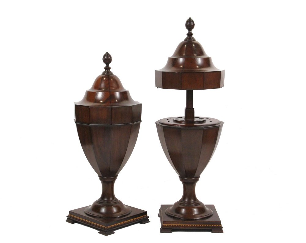 PAIR OF ENGLISH KNIFE URNS - 19th c. Georgian Style, in: PAIR OF ENGLISH KNIFE URNS - 19th c. Georgian Style, in mahogany, lift and lock top revealing fitted interior, with inverted acorn form finial, ten-sided urns on square footed platform base having a s