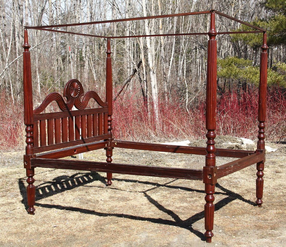 CARIBBEAN FOUR POSTER CANOPY BED - Plantation Bed in: CARIBBEAN FOUR POSTER CANOPY BED - Plantation Bed in Mahogany, having reeded and turned tapered posts, reeded rails, carved headboard with sunburst crest set between scrolls above a fence, all reeded,