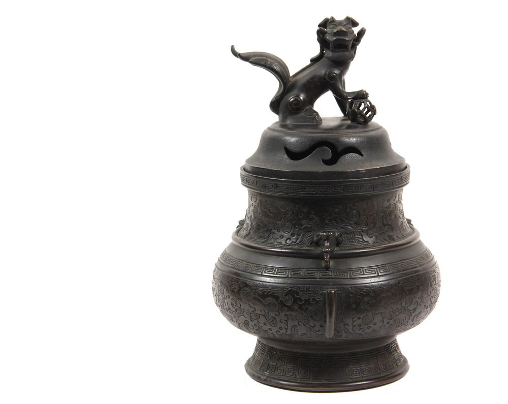 CHINESE BRONZE JAR FORM CENSER - Qing Covered Ovoid: CHINESE BRONZE JAR FORM CENSER - Qing Covered Ovoid Throated and Footed Jar with pierced domed lid having a seated foo lion knop, wing form and keyed band engraving to the body, applied elephant head