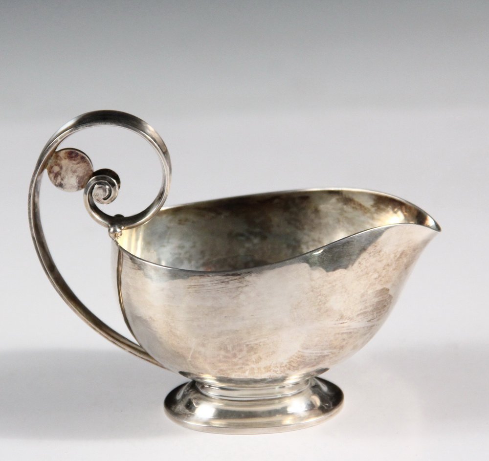 JENSEN CREAM JUG - Georg Jensen Denmark Sterling Silver: JENSEN CREAM JUG - Georg Jensen Denmark Sterling Silver Cream Jug in a disc design, #321C, with Johan Rohde designer mark, post 1945, 3 5/8" high, 4 3/4" wide, 5.68 ozt. Good condition.