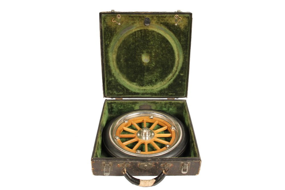 RARE EARLY AUTOMOBILE SALESMAN'S WHEEL SAMPLE - Cased: RARE EARLY AUTOMOBILE SALESMAN'S WHEEL SAMPLE - Cased Sample, probably Ford Model T, circa 1910, containing a twelve-spoke wooden wheel with rubber tire, nickel plated rim, clips and mounts. The wheel