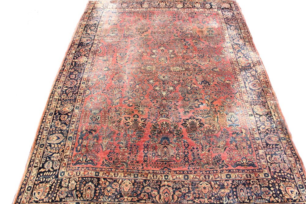 SAROUK CARPET - 9'10" x 13 1/2' - West Persia, second: SAROUK CARPET - 9'10" x 13 1/2' - West Persia, second quarter 20th c., small lobed palmette medallion surrounded by palmettes, rosettes, vases with floral sprays and flowering vines in midnight blue, 