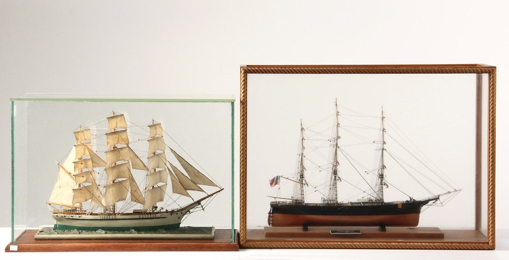 (2) CASED SHIP MODELS - Clipper Ship "Young America" by: (2) CASED SHIP MODELS - Clipper Ship "Young America" by Roger Belanger (1943-2010) of Brunswick, Maine, full hull with rigging only, in a pine and glass case with roped front, 18" x 25" x 8"; PLUS Sai