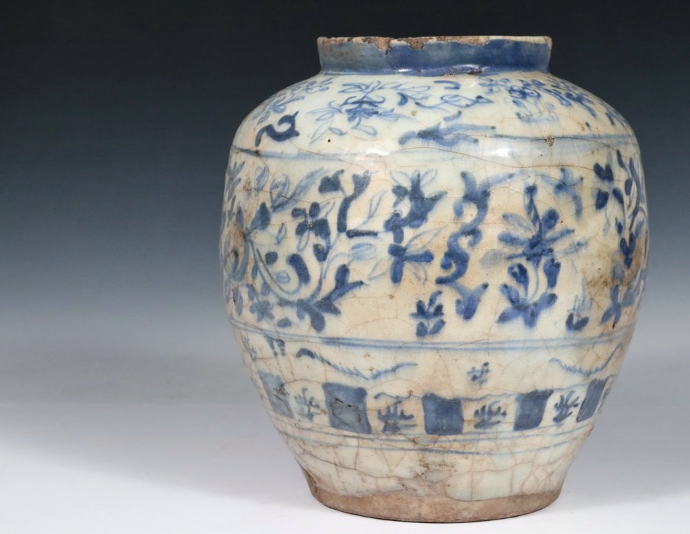 EARLY PERSIAN POTTERY JAR - Seljuk Blue and White: EARLY PERSIAN POTTERY JAR - Seljuk Blue and White Glazed Jar, early 14th c., Syria, influenced by Chinese pottery, having three ranks of foliate and geometric decoration, standing rim, 9 1/2" x 8". Lo