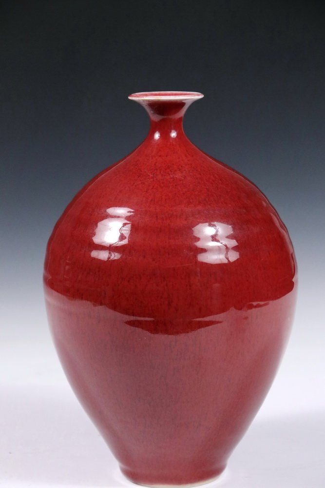 THOMAS BEZANSON (VT, 1929-2007) - Flared Rim Ovoid Art: THOMAS BEZANSON (VT, 1929-2007) - Flared Rim Ovoid Art Pottery Vase with Copper Red Glaze, marked on base "Benedictine Monks, Weston, Vermont", 10 1/4" tall, 6 1/4" diameter. Fine condition.