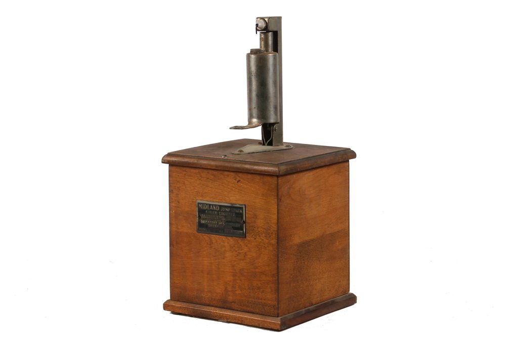 CIGAR STORE SALES STIMULATOR - Countertop "Midland Jump: CIGAR STORE SALES STIMULATOR - Countertop "Midland Jump Spark Cigar Lighter" Model L No. 127091, 1920. Davenport Mfg. Davenport, IA. Oak cabinet, nickel plated components, good original condition. Bat