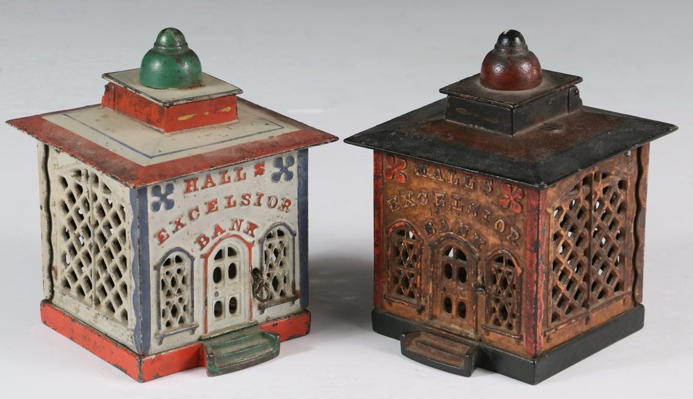 MECHANICAL BANKS - Two 19th c. 'Hall's Excelsior Bank': MECHANICAL BANKS - Two 19th c. 'Hall's Excelsior Bank' Painted Cast Iron Still Banks by J & E Stevens and Company, Cromwell, CT, including: White building with red trim, when cord is pulled, monkey un