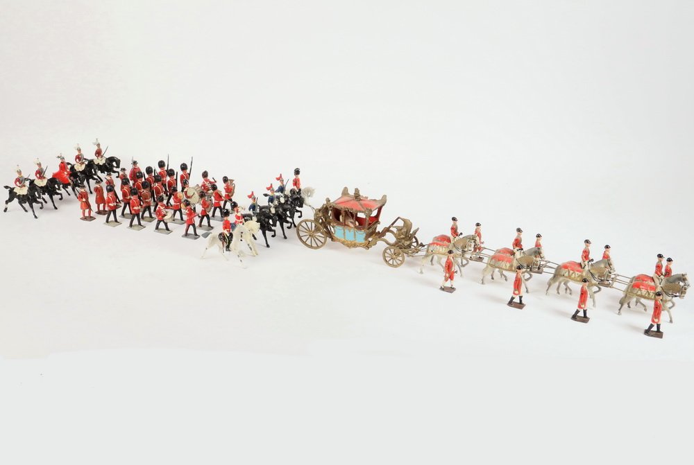 (60 PC) LEAD TOY CORONATION SET - Assembled Set of: (60 PC) LEAD TOY CORONATION SET - Assembled Set of Britains and others, mostly pre-WWI, English Coronation Set including Carriage drawn by eight horses, eleven cavalry, eight band members, fifteen liv