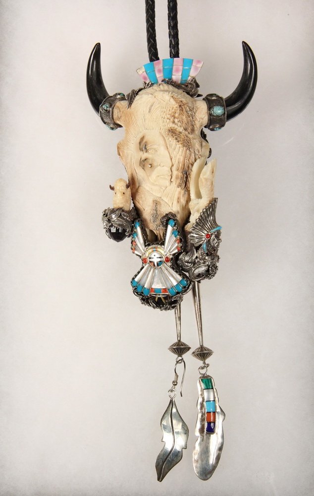 BOLO - Large Custom Designed Man's Bolo with central: BOLO - Large Custom Designed Man's Bolo with central carved bison head in petrified mastodon tusk and fitted with pieces of Zuni jewelry, horns, sterling mounted, back set with (7) round faceted ameth