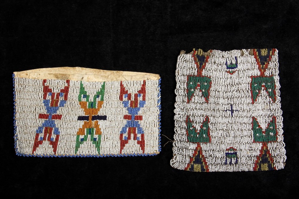 (2 PCS) APACHE BEADWORK - 19th c. Buckskin Wallet with: (2 PCS) APACHE BEADWORK - 19th c. Buckskin Wallet with three fleches and Deerskin Panel with four spirit figures, 4 1/2" x 8" & 6" x 6 1/2". Good condition.