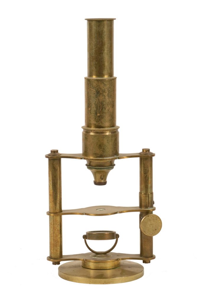 ANTIQUE MICROSCOPE - 19th c. English, soild brass,: ANTIQUE MICROSCOPE - 19th c. English, soild brass, unmarked, monocular, with adjustable table set across two columns with a wheel adjustment, shaped brackets, gimballed mirror on round base. 9 1/2" ta
