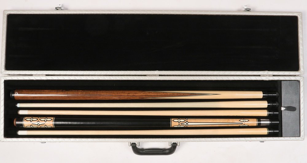 HEUBLER & TIGER POOL CUES IN CASE - "Renaissance" model: HEUBLER & TIGER POOL CUES IN CASE - "Renaissance" model by Paul Heubler in bird's-eye maple with black phenolic and ivorene inlay, black leather grip, nickel fittings, brown rubber butt. Includes two 