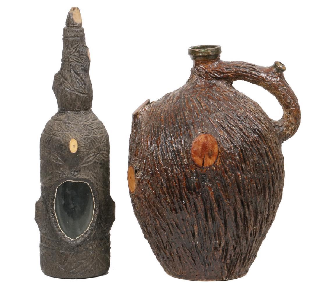 JUG & BOTTLE: (2) Piece Pottery Lot with tree trunk textured and glazed surfaces, including: 19th c. stoneware jug, with handle spout and wood inserts to simulate cut branches, 12" high, 9" wide, top rim chip; and 