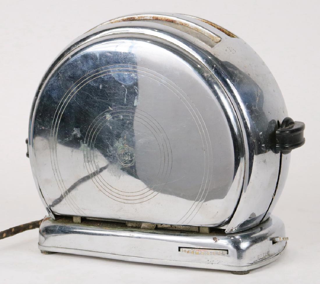 TOASTER: Vintage Merit Made Model A Art Deco Toaster, 1940s, round stainless steel with bakelite handles, original crumb tray, 800 watts/115 volts, engraved M in the center of each side, cloth covered cord, ma