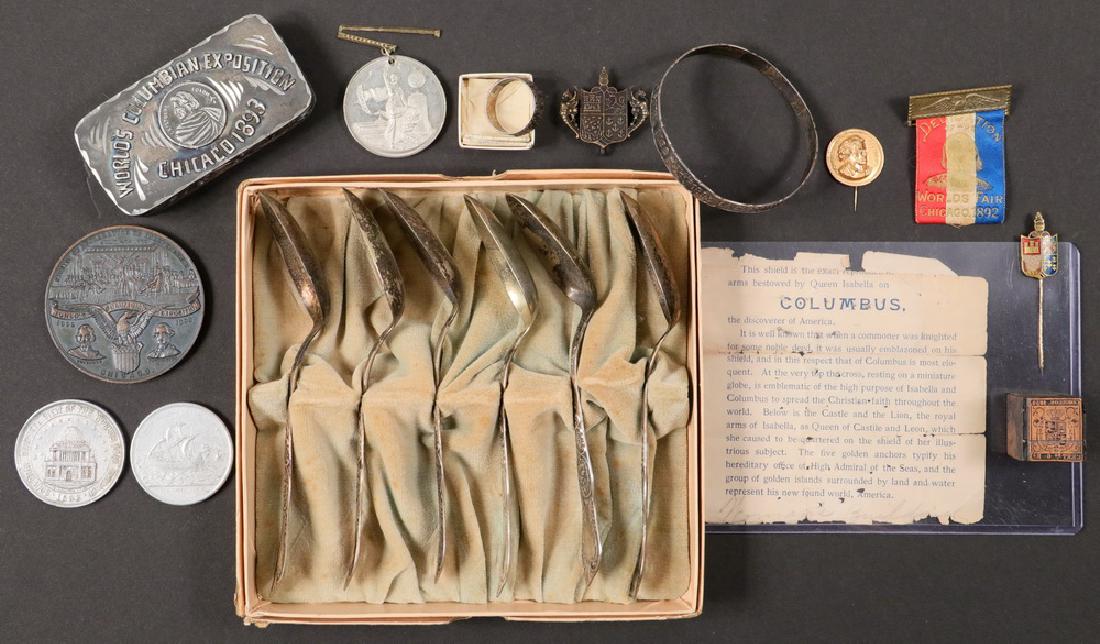 (12 PCS) COLUMBIAN EXPO MEMORABILIA: "The Isabella Ring", sterling silver band ring with raised text around the outside that reads "Recuerdo de la Exposicion de Chicago / 1492 / 1893. / El Anillo Ysabel". In center F / Y with crowns abov