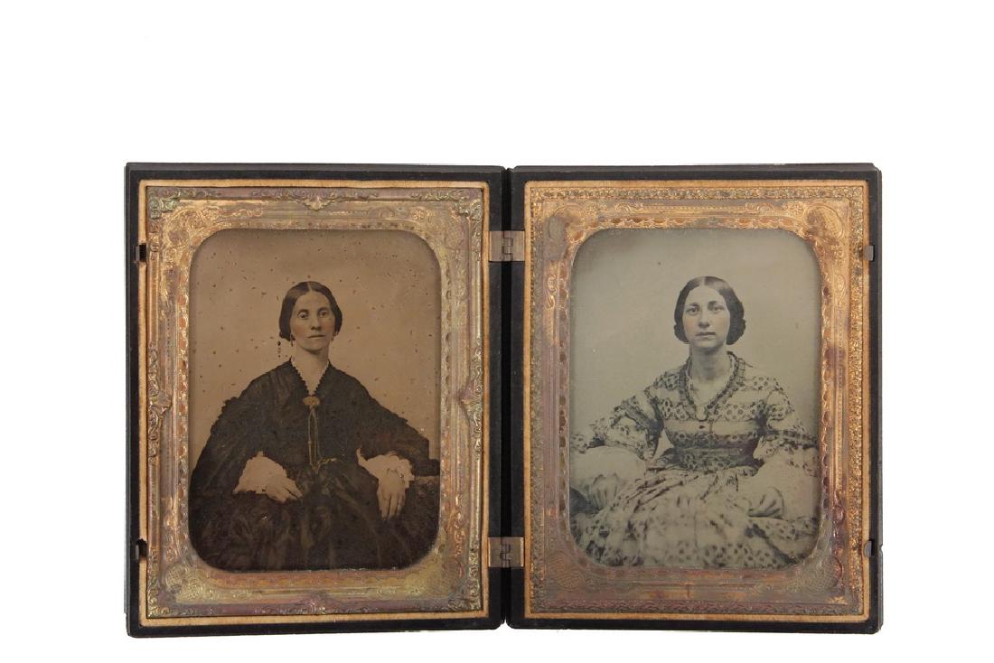 HALF PLATE UNION CASE WITH AMBROTYPES: Circa 1850 Portraits of Two Women, in a magnificent thermoplastic case depicting a utopian haying scene, with a young boy running towards the farmhouse, his hat blowing off in the wind, corral of live