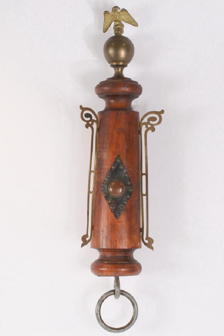 AMERICANA WHIMSY: Folk Art Assemblage, wall hanging, Firehouse themed, with a gilt brass American Eagle finial atop a brass sphere, mounted on a turned walnut stanchion with brass flanges, leather and brass tack diamon