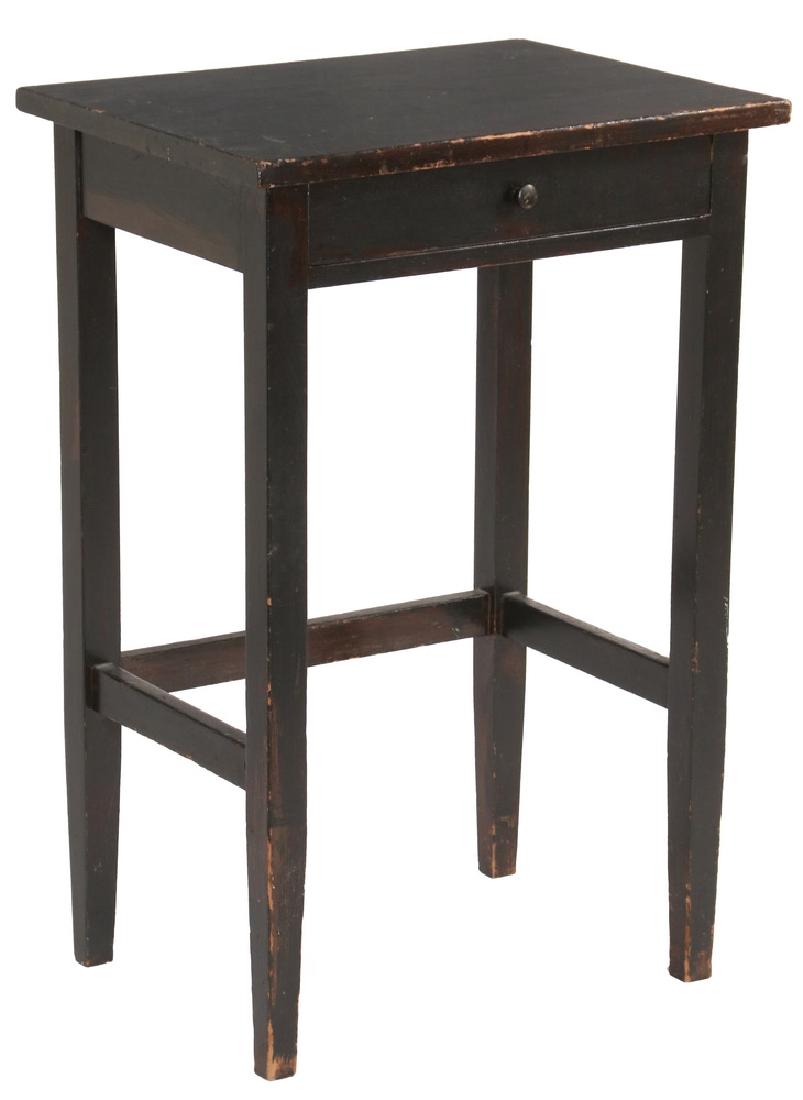 ARTS & CRAFTS PHONE STAND: Circa 1920 "Gossip Stand", in dark brown finish, made specifically to hold a telephone, with overhanging top, a single shallow drawer for the local phone book, plain square legs that taper below the s