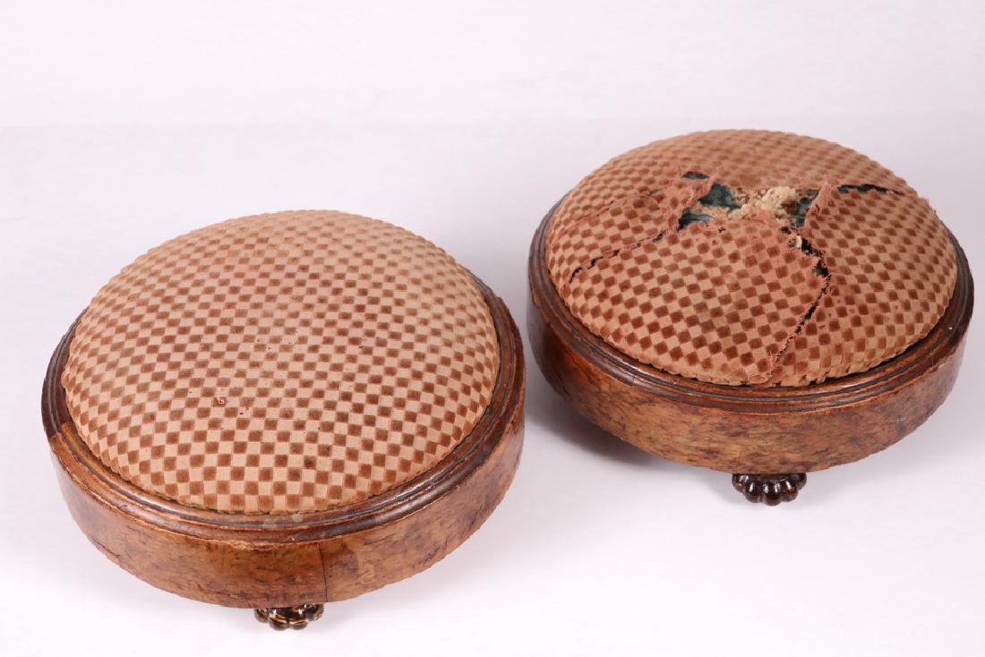 PAIR OF ENGLISH TUFFETS: Low Round Footstools in burled mahogany veneer with three melon form Rockingham pottery feet, domed upholstered tops. 4 1/2" x 10". Worn, minor loss to veneer, need reupholstering, feet are fine.
