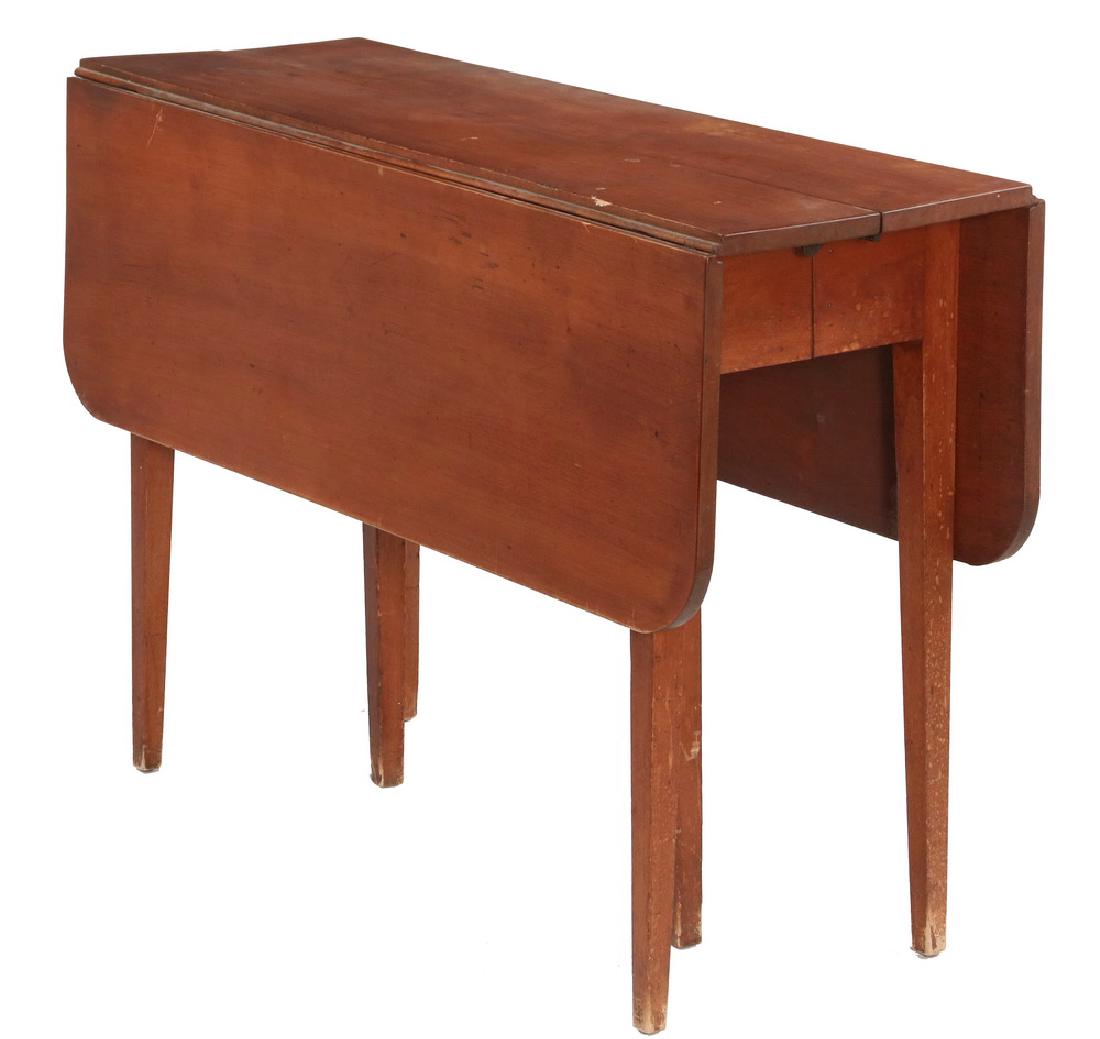 HEPPLEWHITE DROP LEAF TABLE: Country Hepplewhite in original red paint, having rounded corner drop leaves, split top to accept (missing) leaves, pair of inset support legs, raised on simple tapered square legs, 29" x 14" x 42", w