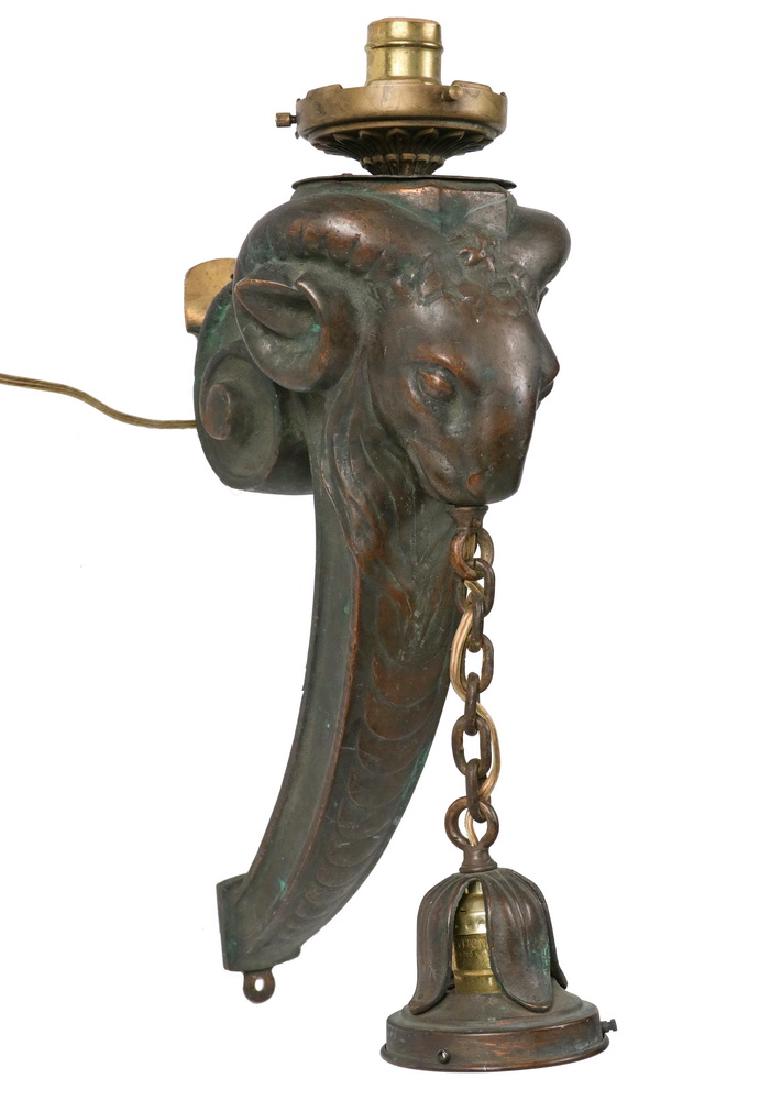 MASSIVE BRONZE SCONCE: Art Nouveau Ram's Head Exterior Cast Bronze Gas Sconce, circa 1890, probably French, converted to an up and down electrical lighting fixture, 15" tall, excluding added socket, nice age patina.
