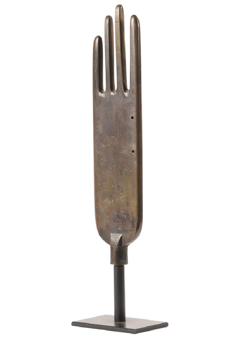 INDUSTRIAL GLOVE FORM: Late 19th c. Bronze Leather Glove Steam Former, on a black metal museum mount, 17 3/4" tall overall. Good condition.
