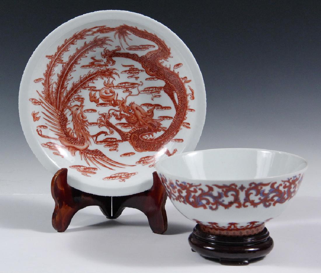 (2 PCS) CHINESE PORCELAIN: Both with Dao Guang marks, but 20th c., with stands, including: Shallow Bowl having red oxide dragon and phoenix fighting over flaming pearl, 1 1/2" x 8" diam; PLUS Deep Bowl with a band of geometric 
