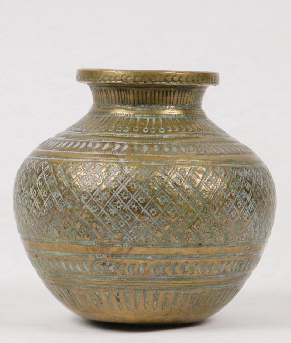 MIDDLE EASTERN BRASS VESSEL: Islamic Persian Qajar Jar with chased exterior, 3 5/8" x 3 3/4" diam. Good condition.
