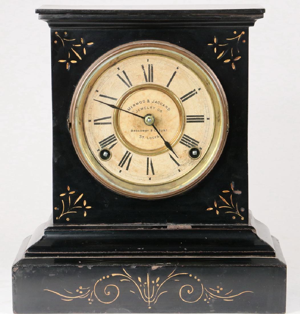 MANTEL CLOCK: Black Marble Mantel Clock marked on dial Mermod & Jaccard Jewelry Co., St. Louis, by Ansonia Clock Co., New York, patented June 9, 1882, brass works, 8 day time & strike movement, with pendulum, 10 1/