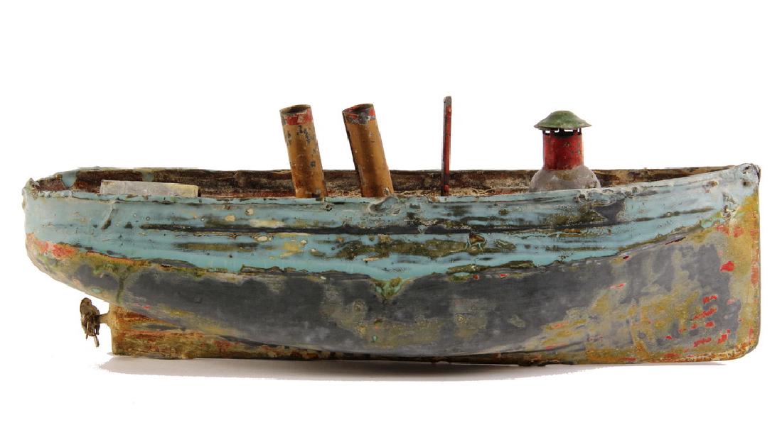 TOY TIN BOAT: German Steam Yacht by Carette, circa 1900, with clockwork drive for propellor. Lacking stacks, sanded, overpainted.