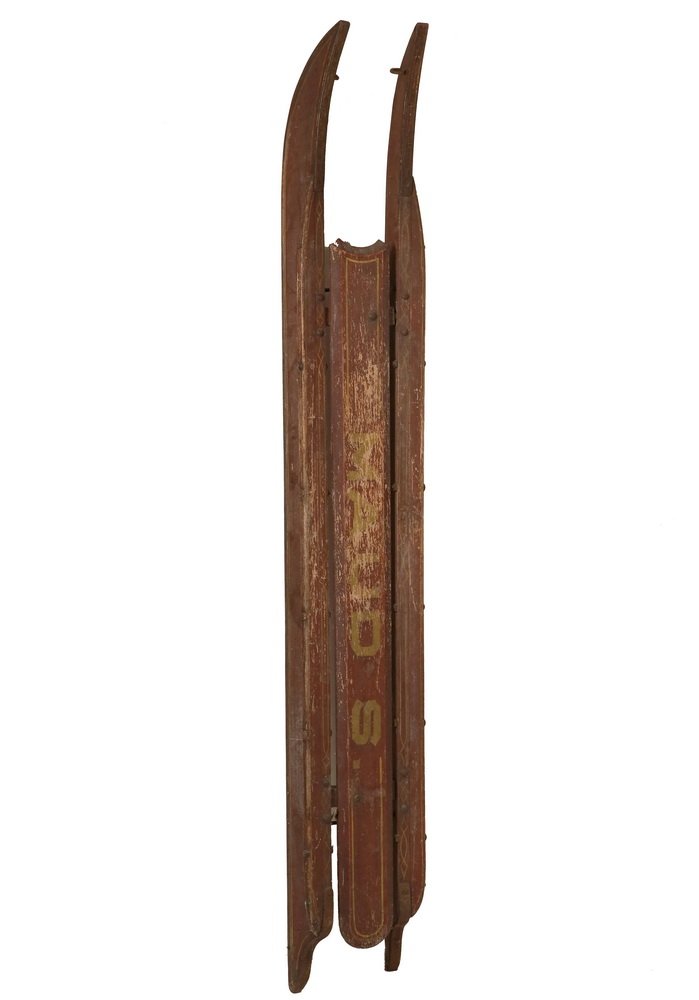 EARLY GIRL'S SLED: Red-painted Sled, America, 19th c., the red-painted wood body with wrought iron runners, the platform with yellow pinstriping, the center board lettered "MAUD S.", old surface, 70" x 10" x 9". Loss to