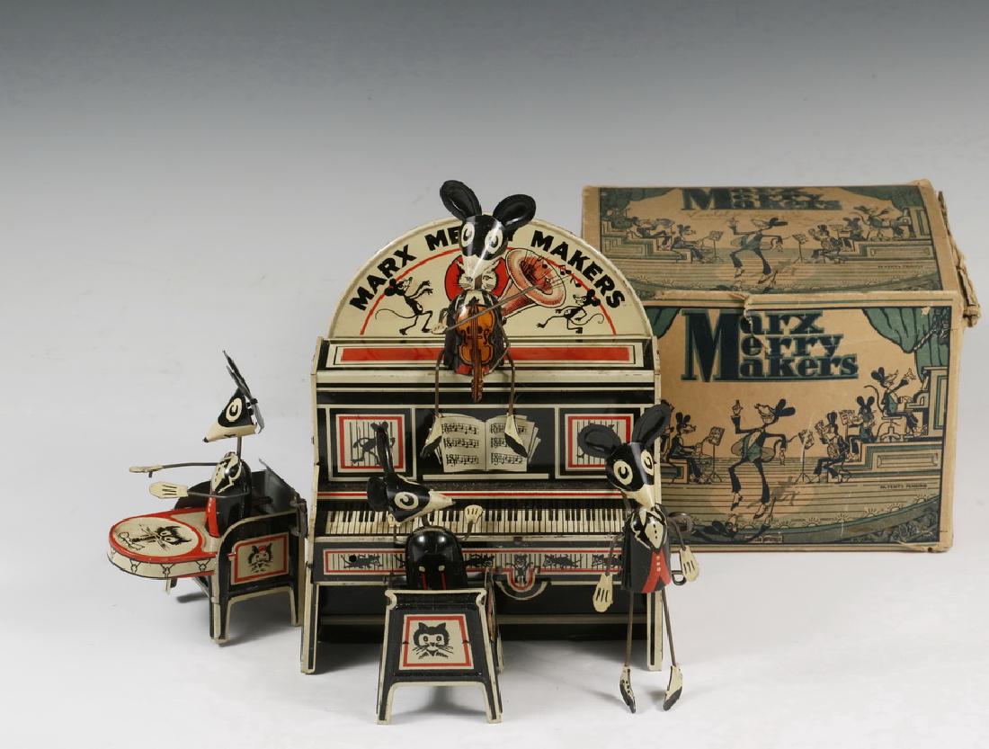 TIN LITHO MOUSE BAND: Marx Merry Makers Tin Litho Spring Wind Mouse Band Toy, complete set in original box with directions, includes four band members, piano and piano top banner, 6" high, 7 1/2" x 5 1/2". Wind up mechanis
