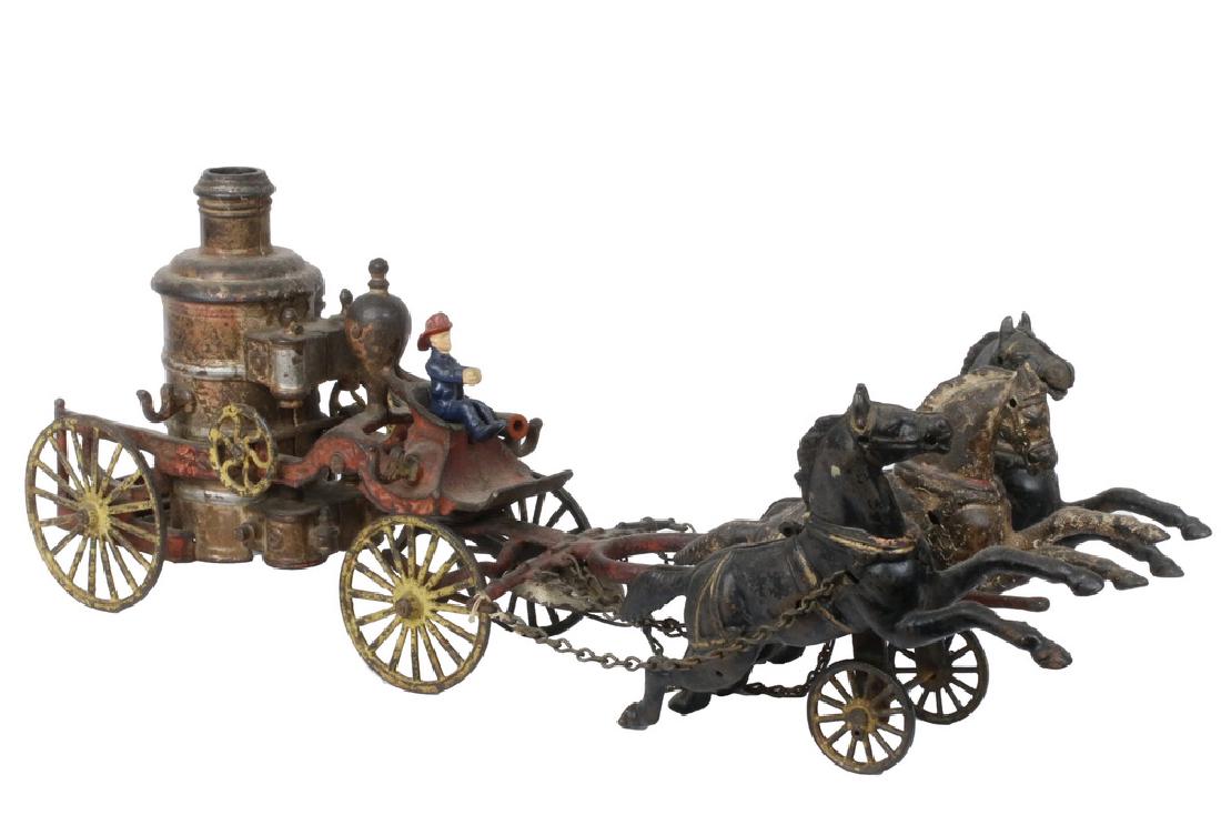 CAST IRON TOY FIRE WAGON: Dent Hardware Co. Cast Iron Fire Pumper with three horses, bell and driver, 8- 1/4" H x 21" x 5". Extensive paint loss, replaced driver, missing rear rider, harness chains and one hose.