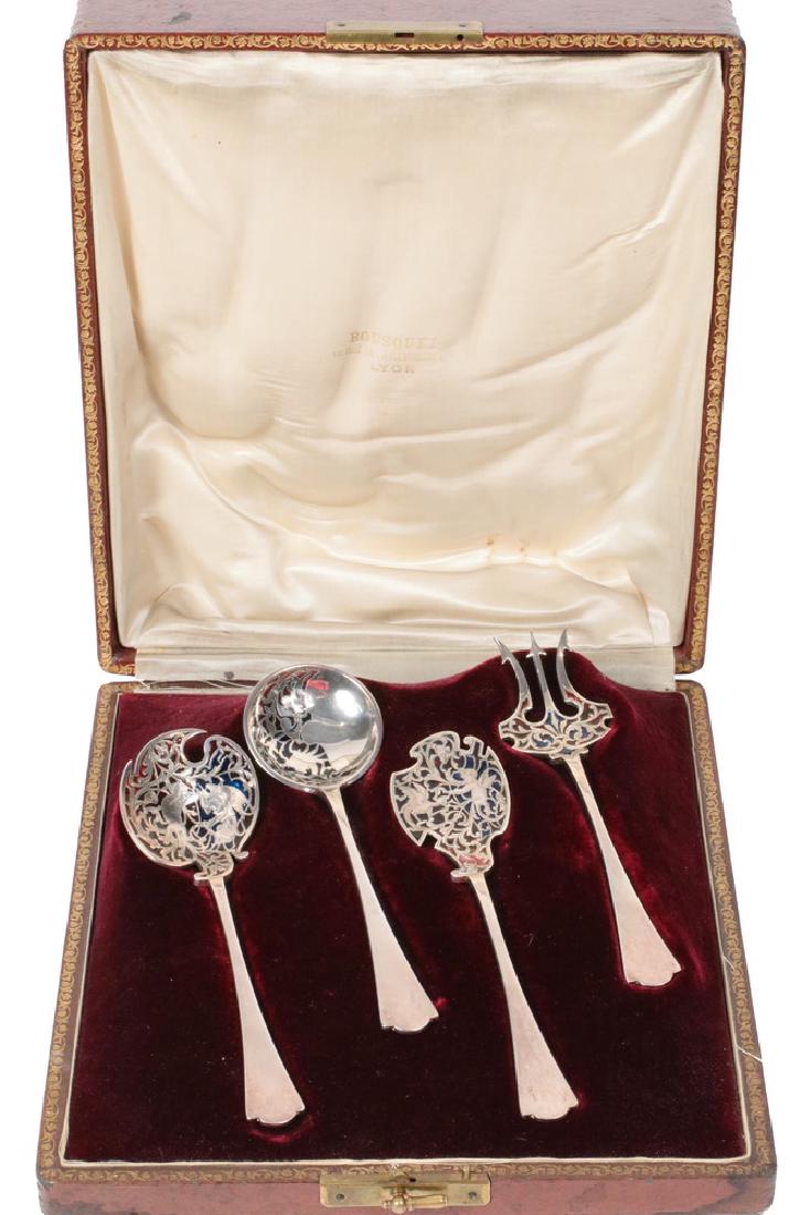 SERVING UTENSILS: Cased (4) Pc. French 950-Silver and Plique-a-Jour Dessert Set by Paris silversmith Alphonse Debain, c. 1890, two pieces with figural decoration of cherubs and dragons, all with blue and red plique-a-j