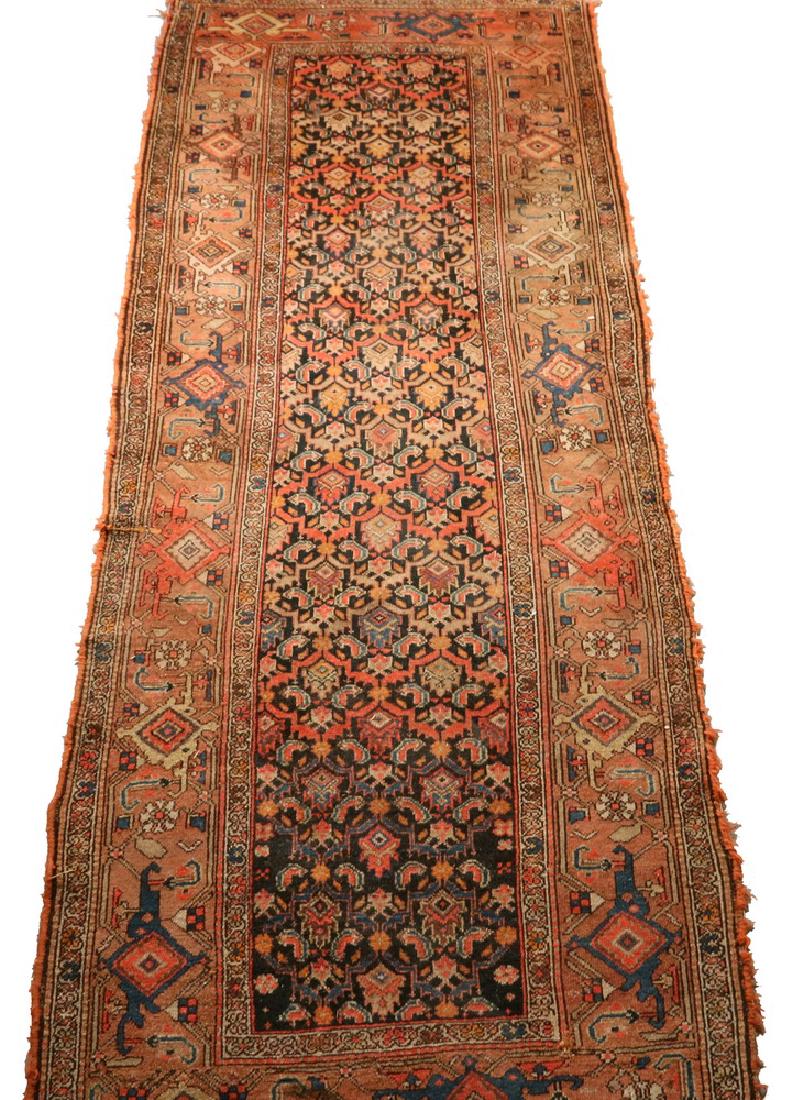 NORTHWEST PERSIA RUG - 3'-8" x 9'-4": Early 20th c., dense overall Herati design in terra cotta, royal blue, gold and beige on a midnight blue field, terra cotta 'turtle' border. Areas of wear, stains, selvage loss, several small holes.