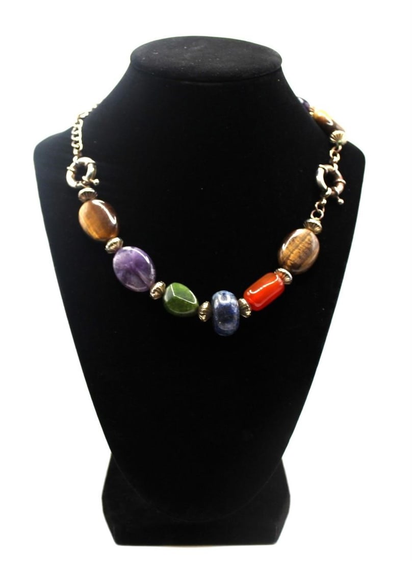 Sterling Necklace jeweled with multiple precious stones: Pretty Sterling Necklace jeweled with multiple precious stonesDesigner/Brand: Unknown & unmarkedMetal Purity: 925Metal: Sterling SilverStone: cats eye, amethyst, carnelian, lapis lazuli & jadeWeight: 