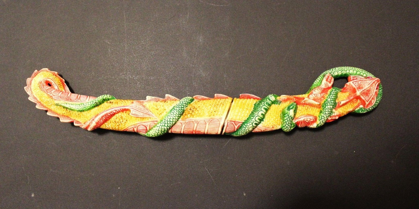 DRAGON & SNAKE WITH HIDDEN KNIFE MADE IN PAKISTAN: Vintage Dragon and snake with hidden knife, Made in Pakistan. Marked stainless steel. Dragon eyes is with pink gem. May need cleaning and blade has some rust. With signs of useDimensions: 14"