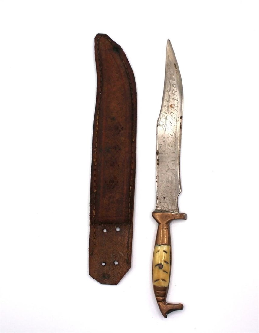 MEXICO EL-CARINOSA BOWIE KNIFE ETCHED W/ SHEATH: Possibly antique Mexico El-Carinosa Bowie knife etched name & duck figure. Bone & brass handle with handmade leather sheath. With signs of useDimensions: knife 7" - Sheath 6.5"