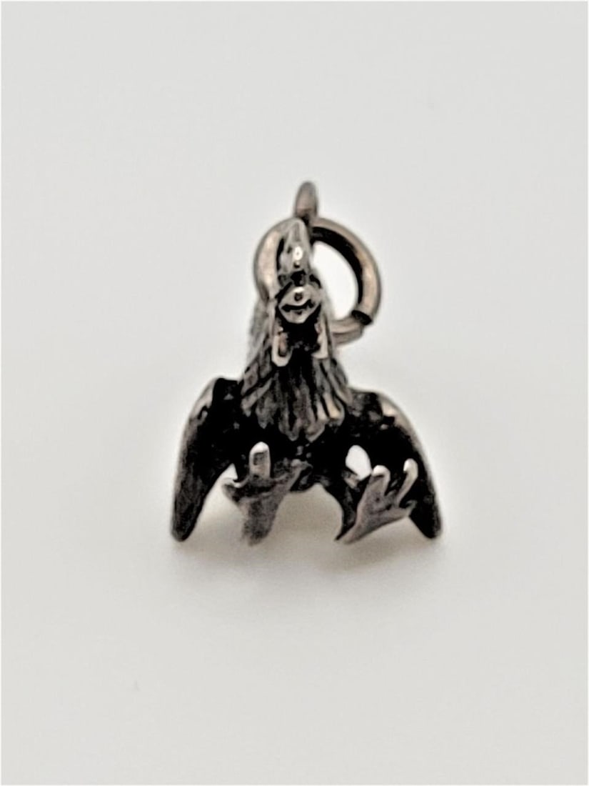 STERLING SILVER SITTING ROOSTER CHARM: Very pretty Vintage Sterling silver sitting rooster charm. Good overallDesigner/Brand: unknownMetal Purity: sterling silverDimensions: 0.7"H x 0.7WWeight: 3.6grams