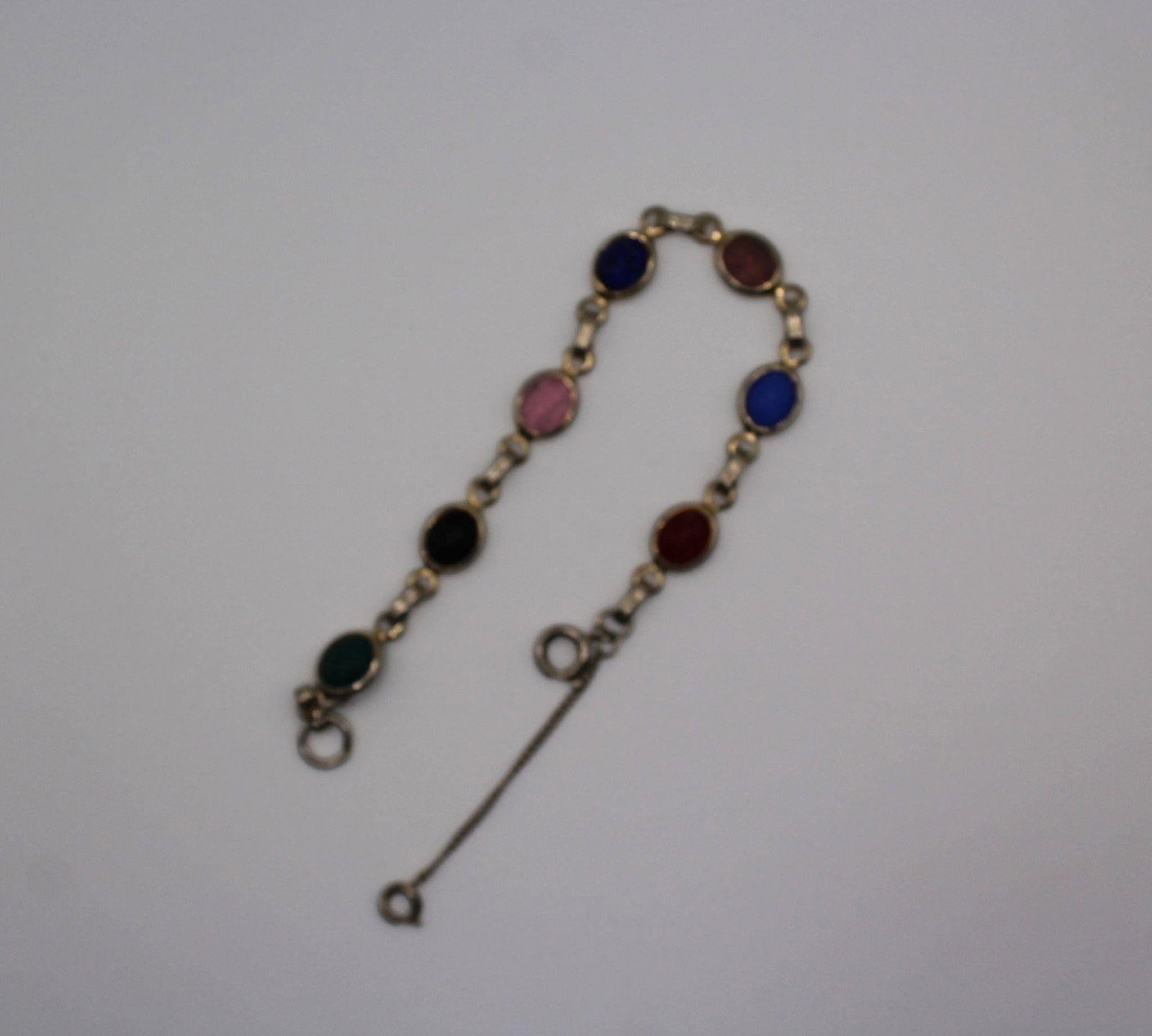 VINTAGE SCARAB MUTLI COLORED ETCHED GLASS BRACELET: Very pretty vintage Scarab multi colored etched glass gold filled setting braceletDesigner/Brand: UnknownMetal Purity: gold filledMetal: gold filledStone: etched glassWeight: 10gramsDimensions: SIZE 8