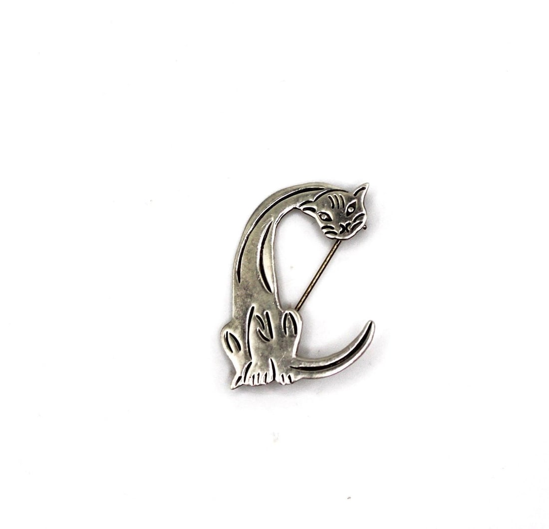 STERLING CAT MEXICO LETTER C BROOCH: STERLING CAT MEXICO LETTER C BROOCH - Part of an alphabet seriesDesigner/Brand: Signed SU MEXICO 925Setting: Sterling silver 925Stone: NONEDimensions: L 2" X W 1.25"Weight: 5 grams