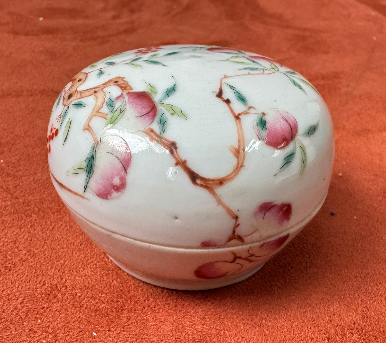 A Qing Dynasty Chinese Porcelain Famille-Rose Covered Box with Floral and Longevity Peach Design (1 of 11)
