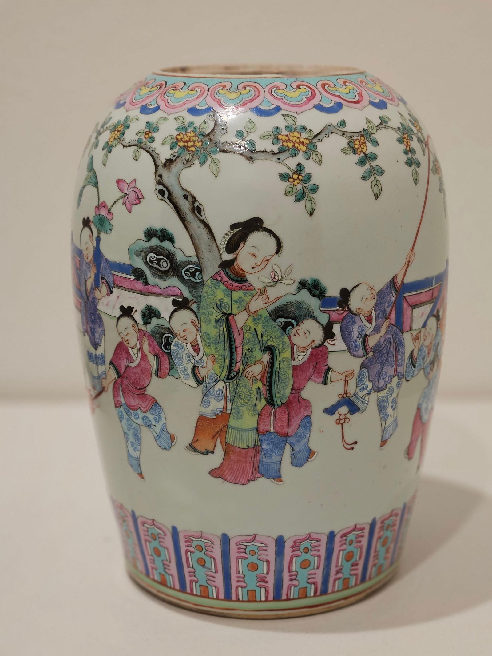 China Antique Famille Rose Ladies at Court Donggua Jar from the Qing Dynasty: A finely potted donggua (winter melon-shaped) jar decorated in famille rose enamels, featuring elegant court ladies in a garden or pavilion setting. The figures are depicted in delicate detail with fl