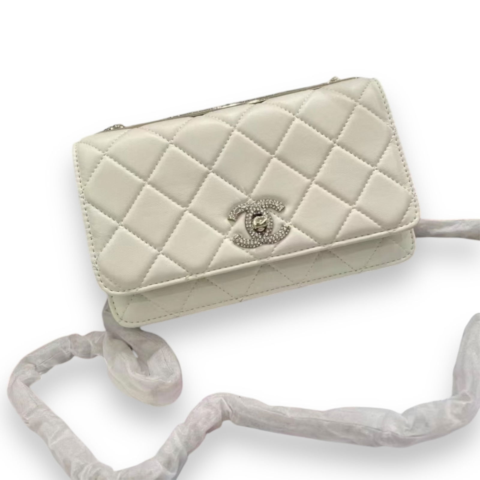 CHANEL Rhinestone Accented White/Red Wallet On Chain Beaute Bag: • CHANEL• White• Quilted Pattern• Red Interior • Rhinestone Accented Front CC Logo• Wallet On Chain (WOC) • Rhinestone Accented Trim • Top Rhinestone CHANEL Log