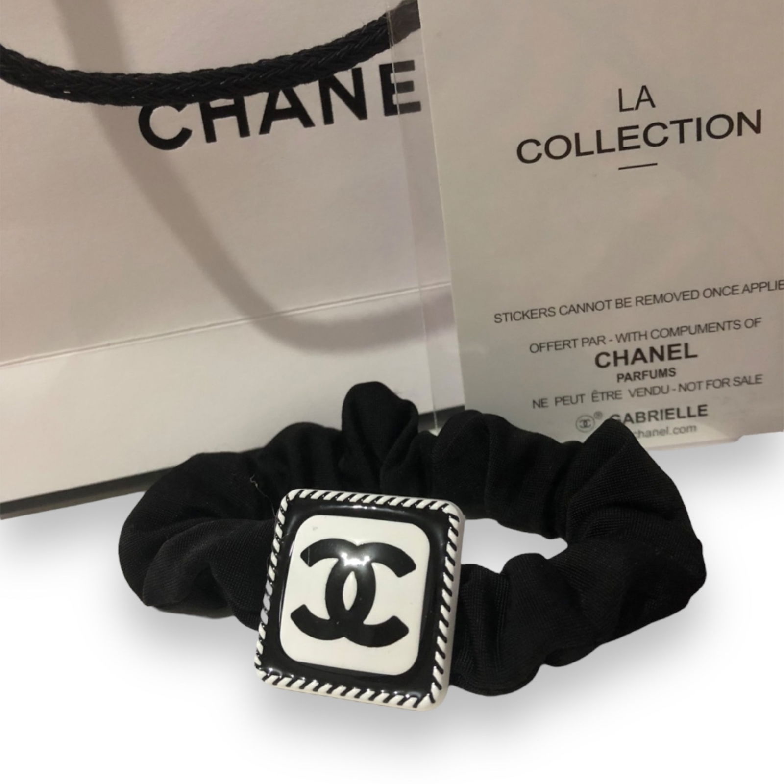CHANEL Black/White Squared CC L.A Collection Hair Tie/Scrunchy: • CHANEL • Black & White• Square Shaped • L.A Collection• Hair Tie/Scrunchy • Black CC Logo• Unopened/In Original Packaging • CHANEL Gift Bag Included