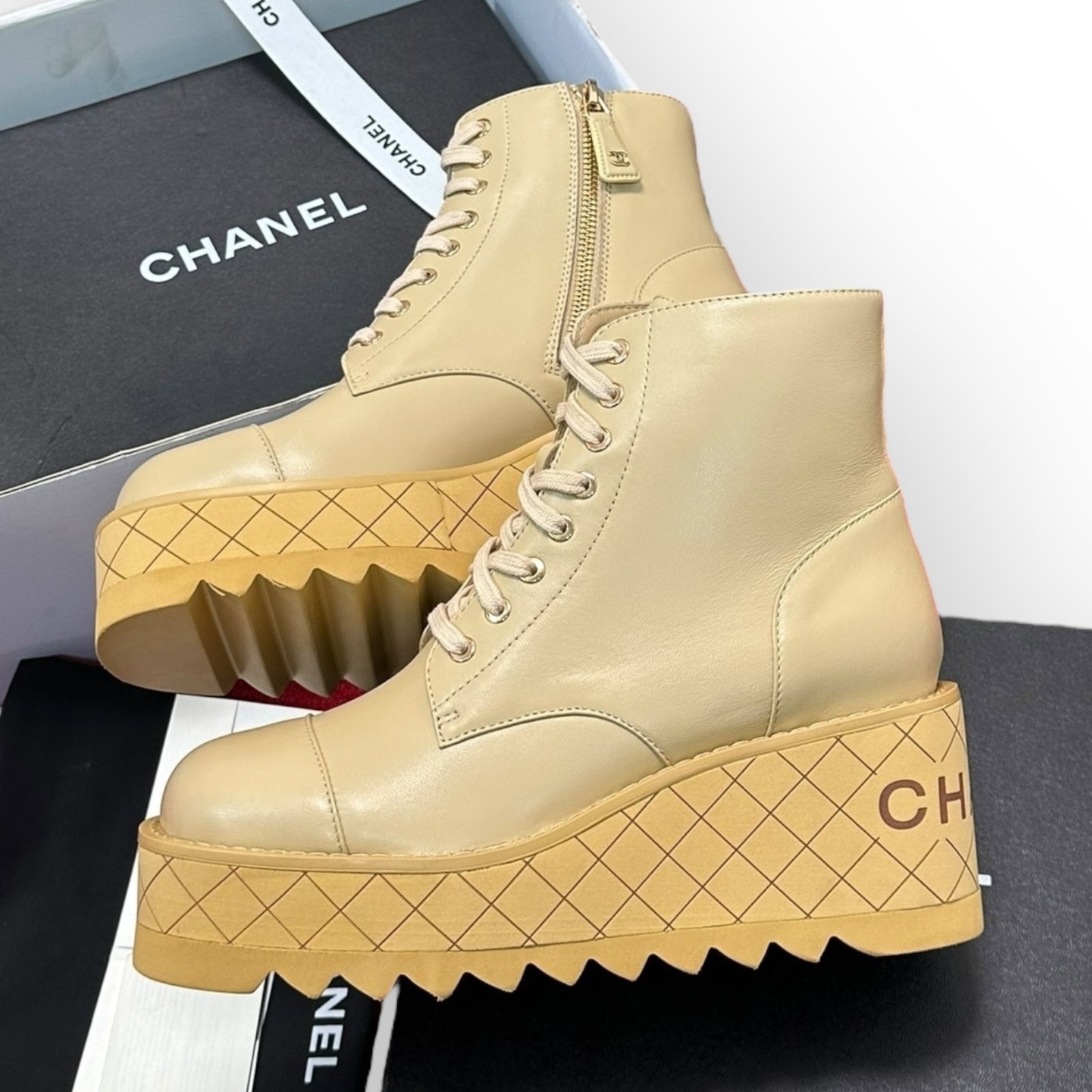 CHANEL Beige Platform Block Heel Rear Logo Beaute Ankle Boots & Box: • CHANEL • Beige • Ankle Boots • Platform/Block Heel • Lace Up • Rear Heel CHANEL Logo • Quilted Pattern On Heel • Women Size: 4.5 - 10 Available • We Will