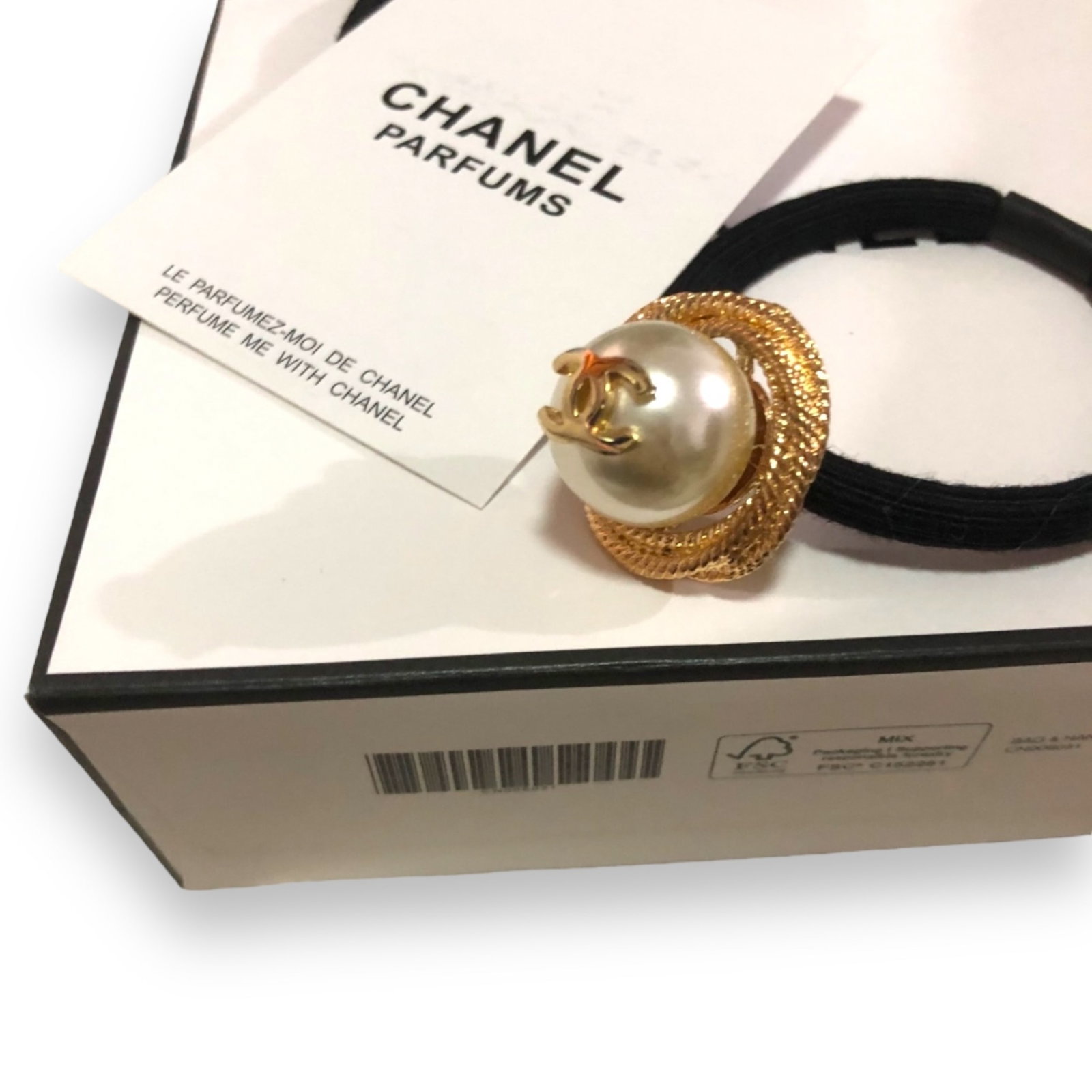 CHANEL Pear/Gold Accented CC L.A Collection Hair Tie: • CHANEL • Pear• Round Shaped• Gold Accents • Gold CC Logo• L.A Collection• Hair Tie • Rhinestone Accented • White Front CC Logo• Unopened/In Original