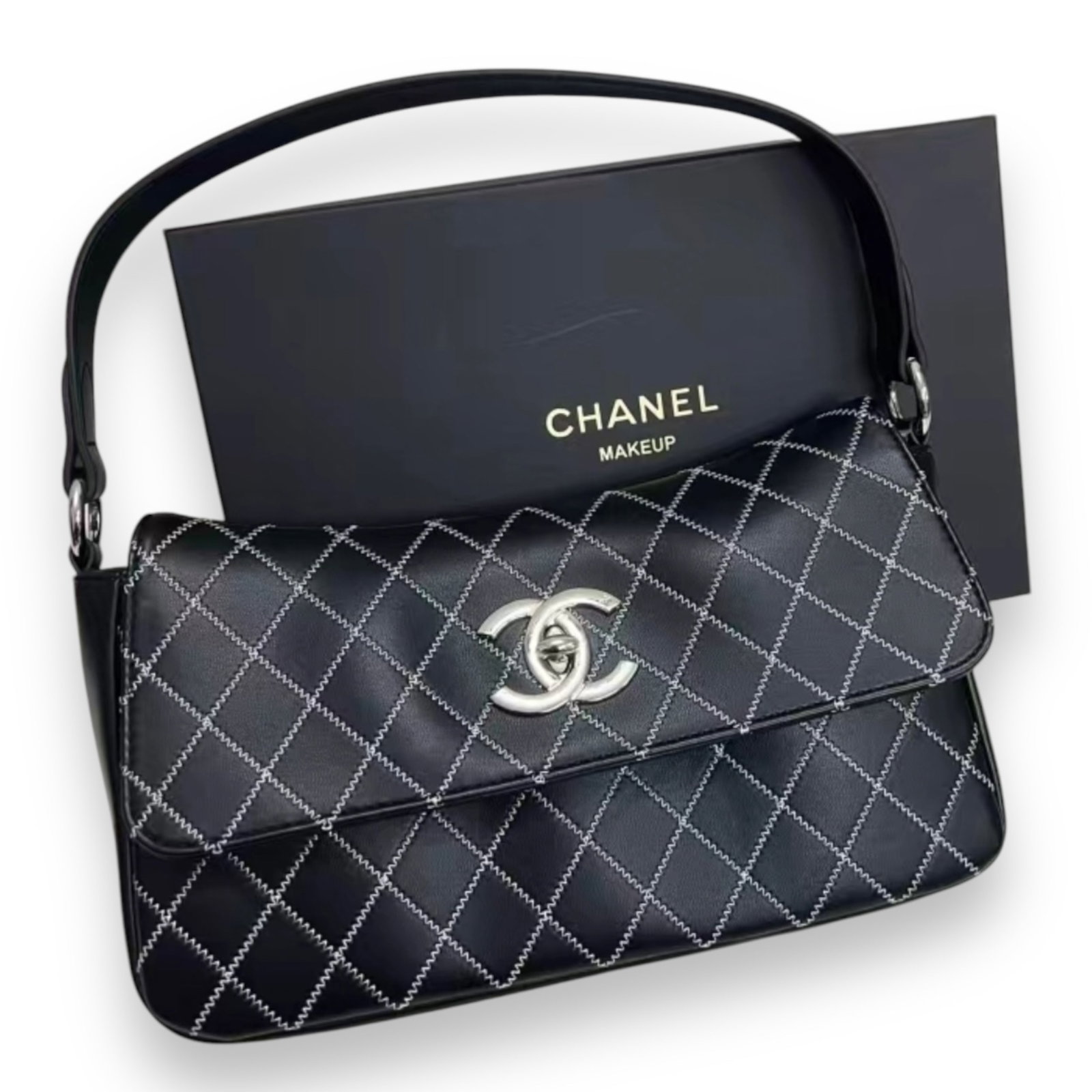 CHANEL Black Beaute Clutch & Original Box: • CHANEL• Black • Quilted Pattern • Silver Tone Hardware • Signature CC Twist Lock Closure • White Accents • Single Strap • Original Box Included • 11" x 6